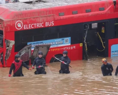 Rescuers Working to Reach Trapped Cars in Flooded South Korea Tunnel